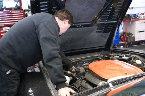 Reid Auto &amp;amp;amp;amp;amp;amp;amp;amp;amp;amp;amp;amp;amp; Electrix team member working on an engine